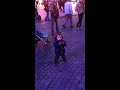 Cute kid dancing, prague square