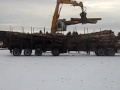 unloading a wood truck