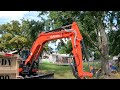 Garage demolition and removal with Kubota kx080 excavator