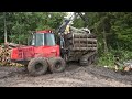 Valmet 840.3 logging in rainy summer forest, big load