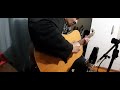 Marios Iliopoulos jamming with his 12 string Takamine acoustic