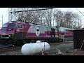 CSX L005 power eastbound to Framingham and westbound MBTA commuter rail in Ashland MA on 12/6/23