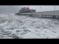 Hurricane Nicole wind, waves at Daytona Beach, Florida, pier