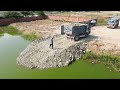 Amazing Action Dump truck 5T unloading stone into water filling up with Bulldozer pushing stone into