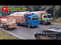 Three Trailer Trucks Loaded with Mining Monster Trucks from China and a Tail Fighting Truck on Frog