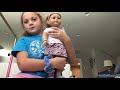 Caroline dressing American girl doll