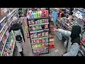 Moment have-a-go hero shopkeeper traps machete-wielding robbers inside shop