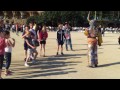 Cute kids playing and dancing in Parc Güell, Barcelona