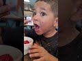 grandson doesn't want to share his strawberries!