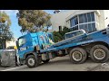 Quick Skips Truck unloading two large skips at Wetherill Park Depot