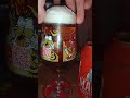 Pouring a can of Madri into a Madri pint glass