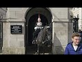 CHINESE KID BLOCKS THE KING'S GUARD. Kid refuses to move until he has a picture at Horse Guards!