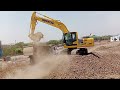 Komatsu PC205-10MO Loading Chipped Material in construction Site