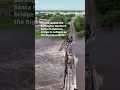 Flooding collapses bridge and threatens 'imminent failure' of dam #Shorts