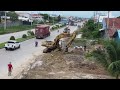 New Project Techniques Push Stone Clearing drainage system Next to Highway Road to Create a walkway