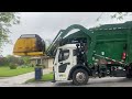Waste management Mack LR on rainy garbage