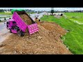 Technique Operated Of filling up Use Small Dump truck With Dozer D31P KOMATSU Push to clean the soil