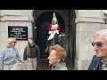 IDIOT US TOURIST INTERRUPTS THE GUARD CHANGE - Guard says get behind the bollards at Horse Guards!