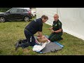 Paramedic demonstrating good CPR with AED