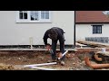 Laying the 110mm plastic underground drainage pipes