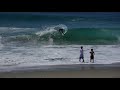 Professional Skimboarders Slide Out to Waves at a Creek Mouth - Raw Footage