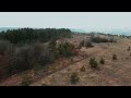 Aerial Drone Footage View  Flight Over Autumn Hills with Forest  Soft Light  Yellow Faded Grass