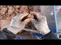 POV of a cellar digout in wet clay