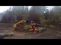 Cat 279D skid steer moving Burnt logs