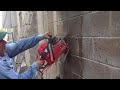 Cutting concrete block with diamond chainsaw