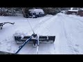 Chevy truck with a rear mounted plow