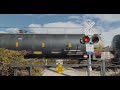[4K] Train goes through small railroad crossing!