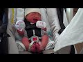 Loading baby in her car seat for the very first time