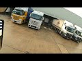 Truck driving reversing into a bay between two truck very tight C+E