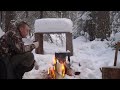 A MAN SURVIVES AN EXTREMELY COLD NIGHT IN A COZY LOG CABIN. CABIN LIFE.