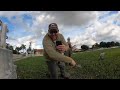 14 year old boy catches a tarpon using a fly rod under a bridge in Miami, Florida