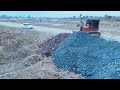 Nice New Working!! Red Bulldozer Pushing Gravel And Soil Filling a Land With 25T Dump Trucks