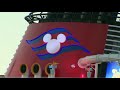 Disney Fantasy cruise ship arrives at Port Canaveral, Florida with fireworks and characters