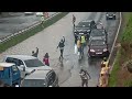 Traffic Nightmare: Stalled Car in Flooded Underpass.