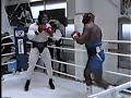 Oliver McCall lands a bomb on Mike Tyson