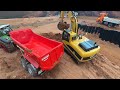 Rc excavator construction site earth excavation with truck and tractor. Constructionworld part2
