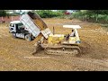 Fantastic teamwork Operation by KOMATSU D40P Push soil into pit and Dump Truck filling land