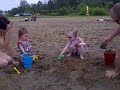 Aven and lorien playing in the sand.