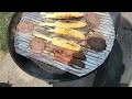 grilling burgers bratwurst and corn on the cob