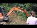 Excavator paved the way up the mountain, hoeing and leveling to Building house, Building a new Life
