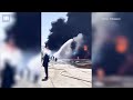 Oil tanks burn in Russia after suspected strike by Ukrainian drones