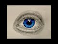 Realistic colored pencil plus graphite eye drawing.