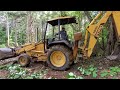 Clearing Land with a backhoe part 2