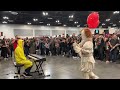 Clown hears Dr. Dre. Shocks the crowd with moves.