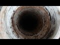 Unclogging a sewer drain with a plunger (from the outside cleanout)