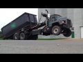 Roll Off truck picking up a heavy load